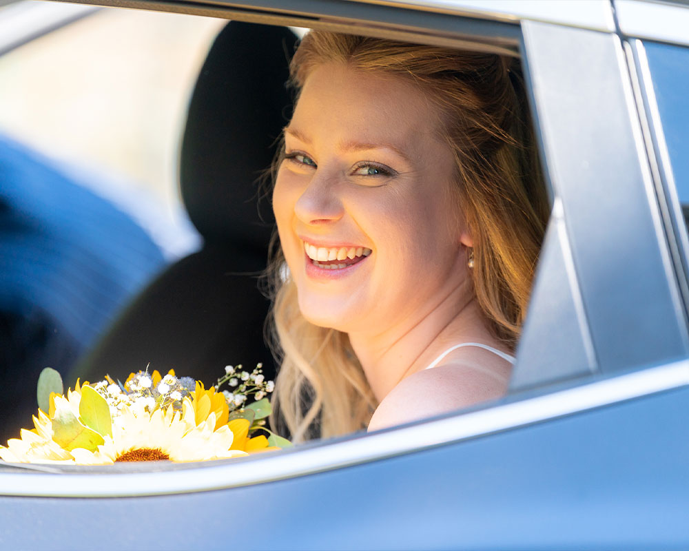 Bride in her Wedding Car